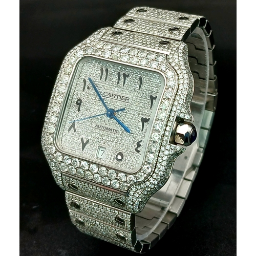 A Custom Diamond Cartier Santos Automatic Gents Dress Watch. Model WSSA0009. Stainless steel diamond encrusted bracelet and case - 38mm. Encrusted with c. 2.5ctw of round cut diamonds. Diamond encrusted dial with Arabic Markers. Comes with a warranty card and case. In good condition and working order. Note: Diamonds have been custom after-market fitted. TTB066.