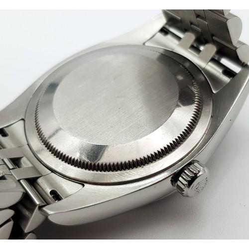 696 - A Rolex Oyster Perpetual Datejust Gents Watch. Stainless steel bracelet and case - 36mm. Black dial ... 