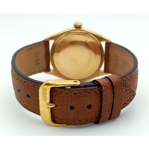 1819 - A Vintage 18K Gold Rolex Oyster Perpetual Gents Watch. Brown leather strap. 18K gold case - 34mm. Fl... 