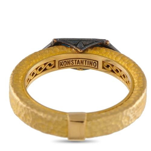 19 - A Konstantino 18K Yellow Gold Black Diamond and Topaz Ring. A blue Topaz gemstone in an east-west ar... 
