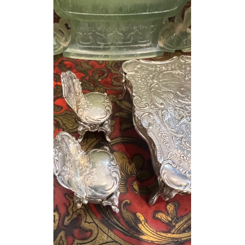 36 - A SET OF EARLY 20TH CENTURY SILVER MINIATURE FURNITURE, C.1900the miniature set comprising a dining ... 
