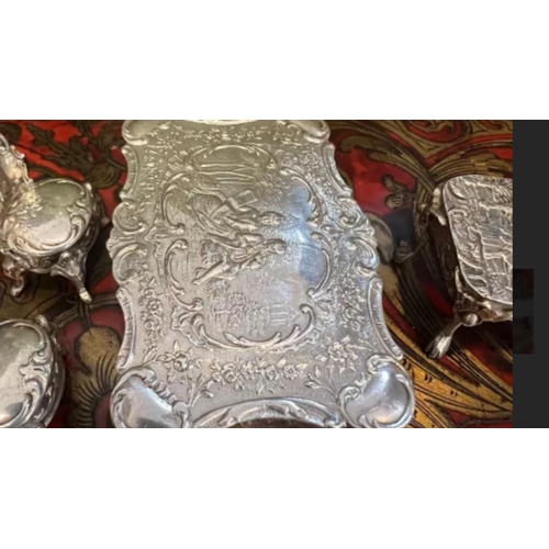 36 - A SET OF EARLY 20TH CENTURY SILVER MINIATURE FURNITURE, C.1900the miniature set comprising a dining ... 