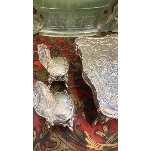36 - A SET OF EARLY 20TH CENTURY SILVER MINIATURE FURNITURE, C.1900the miniature set comprising a dining ... 