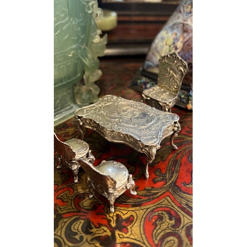 36 - A SET OF EARLY 20TH CENTURY SILVER MINIATURE FURNITURE, C.1900the miniature set comprising a dining ... 