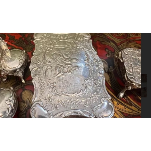 36 - A SET OF EARLY 20TH CENTURY SILVER MINIATURE FURNITURE, C.1900the miniature set comprising a dining ... 