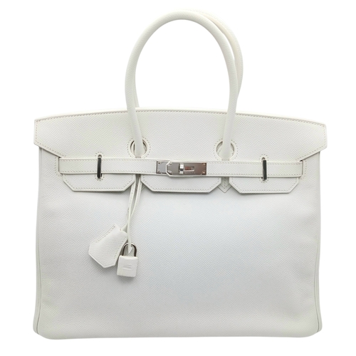 An Hermès White Epsom Birkin 35 Handbag. White Epsom leather exterior with silver-toned hardware, double rolled top handles, front leather sangles, hanging clochette with key, padlock and four protective base studs. Turn-lock closure opening to a white leather interior with one zipped inner side pocket and one open inner side pocket. Approx 35cm length x 28cm height. Square K stamp, 2007. In good overall condition, but please see photos or request a condition report. Ref: H011