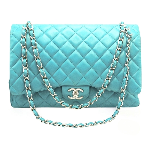 A Tiffany Blue Chanel Jumbo Classic Double Flap Bag. Quilted Tiffany blue leather exterior with silver-toned hardware, chain and leather shoulder strap and CC turn-lock closure. Matching leather interior with one main compartment, inner slip pockets and a zipped pocket to the underside of the flap. Features two opened pockets exterior. Approx 34cm length x 21cm height x 10cm depth. Some pen marks, signs of wear and tear to the leather. Comes with a certificate of authenticity, box and dust cover. Please see photos or request a condition report. Ref: 28704.