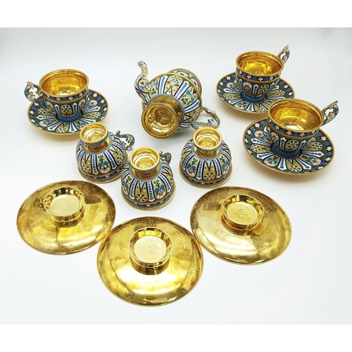 10 - A Large Russian Style Enamelled Silver Gilt Tea Set. Comprising: one tea pot (approx 18cm height), s... 
