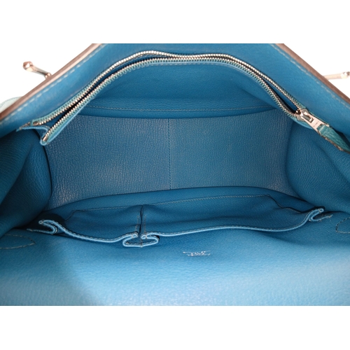 5 - An Hermès Jypsière 31 Handbag. Turquoise pebbled leather exterior with silver-toned hardware, adjust... 