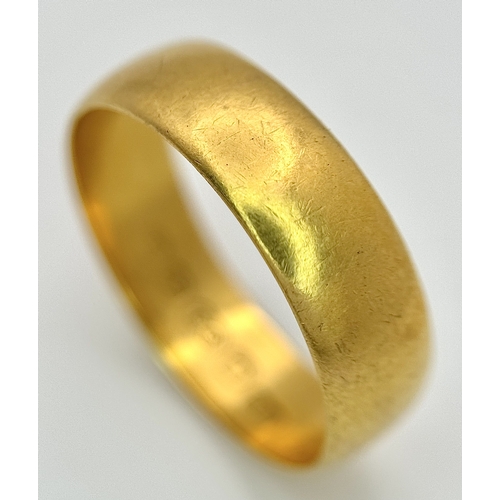 16 - A 22K Yellow Gold Wedding Band. 5.7mm Band Width, Size P/Q. Total Weight 4.41 Grams.