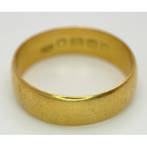 16 - A 22K Yellow Gold Wedding Band. 5.7mm Band Width, Size P/Q. Total Weight 4.41 Grams.