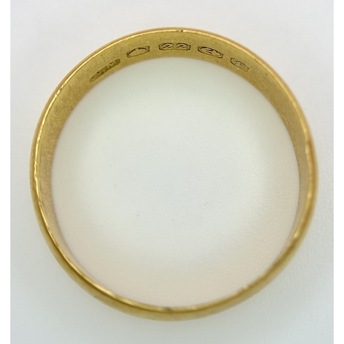 16 - A 22K Yellow Gold Wedding Band. 5.7mm Band Width, Size P/Q. Total Weight 4.41 Grams.