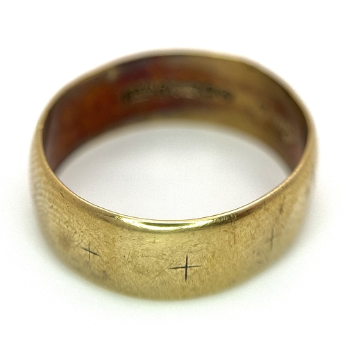 44 - A 9K Yellow Gold Wedding Band. 6.6mm Band Width, Size R. Total Weight 3.11 Grams.