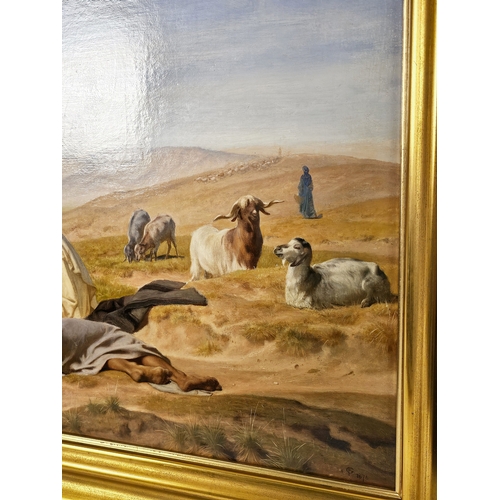 45 - Frederick Goodall R.A. (British, 1822–1904), Arabs and Camels at a Watering Place. Signed with monog... 