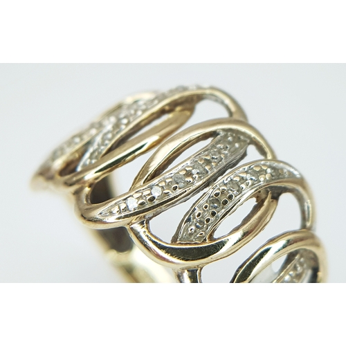503 - A 9K YELLOW GOLD, DIAMOND SET, CIRCLES DESIGN RING. 3.4G, SIZE P. SC 5032
