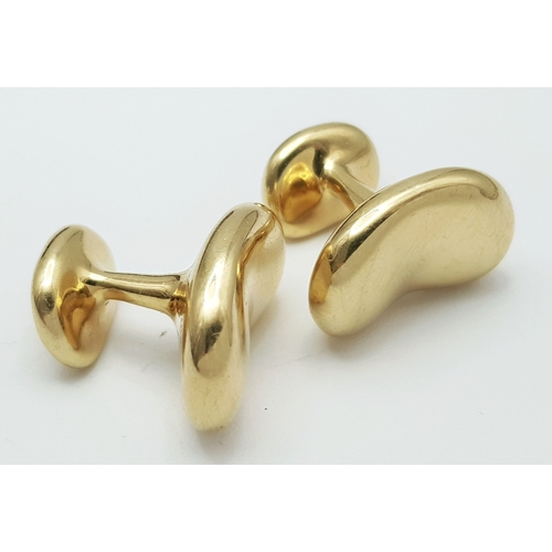 6 - A PAIR OF TIFFANY AND CO, ELSA PERETTI, 18K YELLOW GOLD, BEAN CUFFLINKS. 23.8G. TAN 5005.