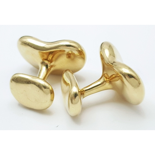 6 - A PAIR OF TIFFANY AND CO, ELSA PERETTI, 18K YELLOW GOLD, BEAN CUFFLINKS. 23.8G. TAN 5005.