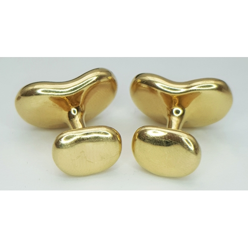 6 - A PAIR OF TIFFANY AND CO, ELSA PERETTI, 18K YELLOW GOLD, BEAN CUFFLINKS. 23.8G. TAN 5005.