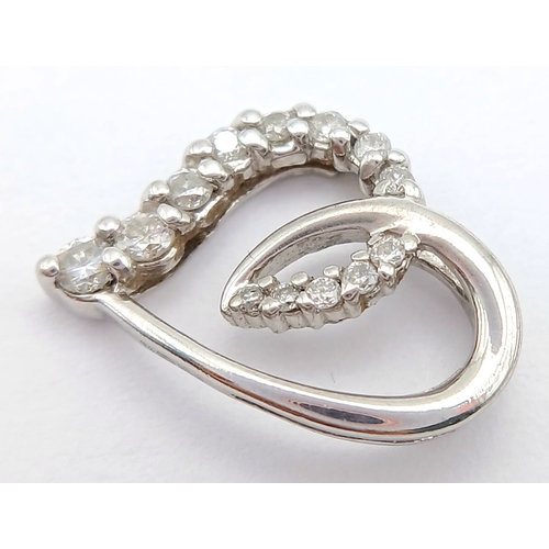 559 - A 9K WHITE GOLD, DIAMOND SET, OPEN HEART PENDANT. ENGRAVED ON THE BACK 