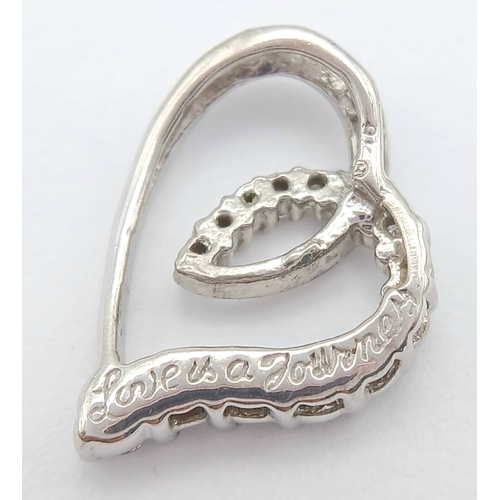 559 - A 9K WHITE GOLD, DIAMOND SET, OPEN HEART PENDANT. ENGRAVED ON THE BACK 