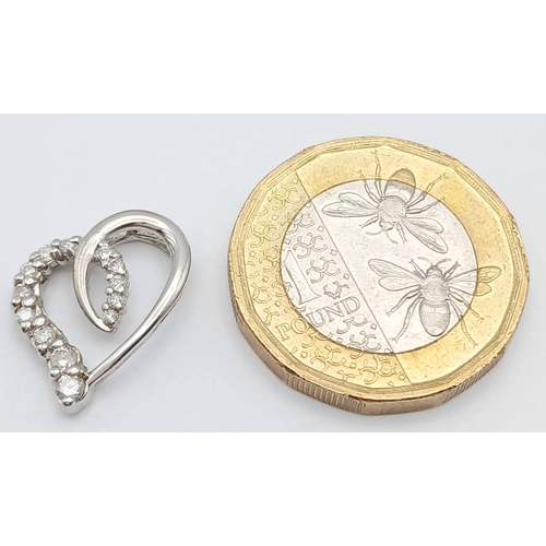 559 - A 9K WHITE GOLD, DIAMOND SET, OPEN HEART PENDANT. ENGRAVED ON THE BACK 