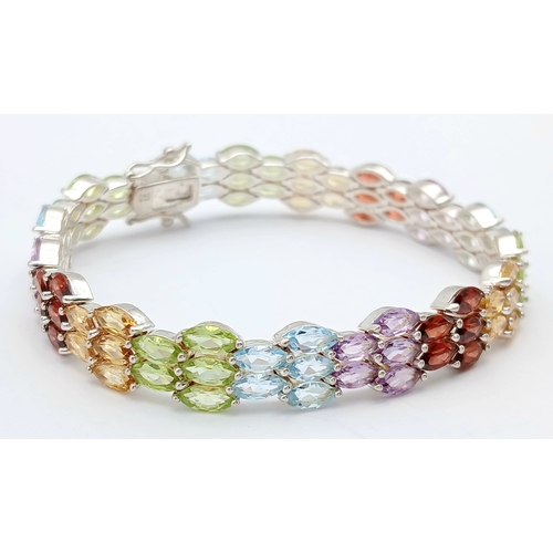 501 - A Beautiful Sterling Silver Blue Topaz, Peridot, Citrine, Garnet and Amethyst Multi-Row Tennis Brace... 