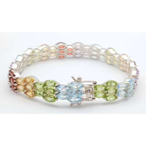 501 - A Beautiful Sterling Silver Blue Topaz, Peridot, Citrine, Garnet and Amethyst Multi-Row Tennis Brace... 