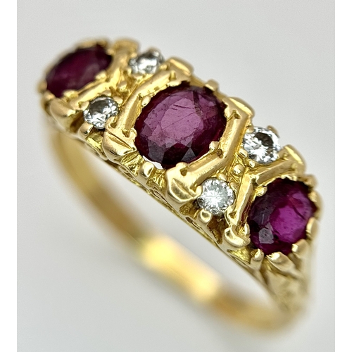 11 - AN 18K GOLD 3 STONE GYPSY STYLE RING WITH LARGE RUBY STONES SEPERATED BY 4 DIAMONDS .     5.8gms    ... 