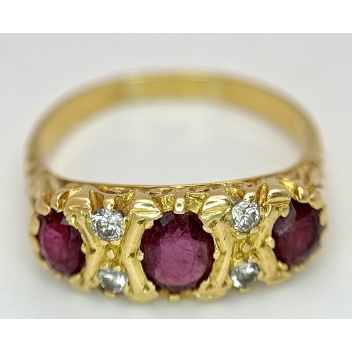 11 - AN 18K GOLD 3 STONE GYPSY STYLE RING WITH LARGE RUBY STONES SEPERATED BY 4 DIAMONDS .     5.8gms    ... 