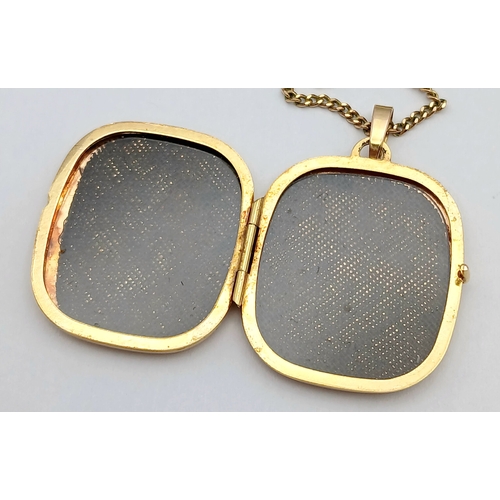 22 - A 9K GOLD LOCKET PENDANT ON A 56cms 9K GOLD NECK CHAIN WITH NICELY DECORATED FRONT AND UNUSUAL SQUAR... 