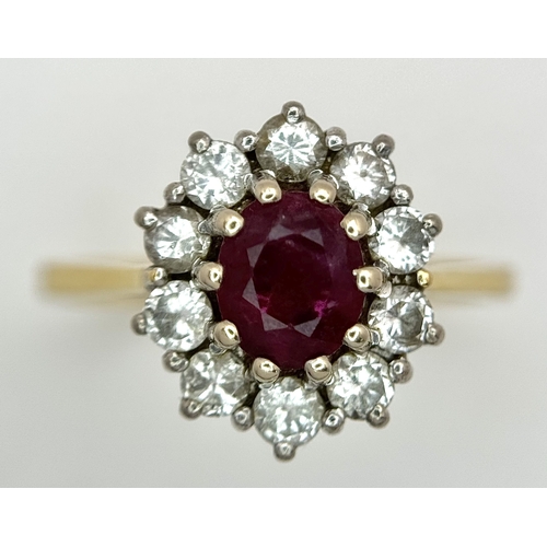 3 - AN 18K GOLD RING WITH RUBY CENTRE STONE SURROUNDED BY QUALITY DIAMONDS .        3.8gms    size O/P