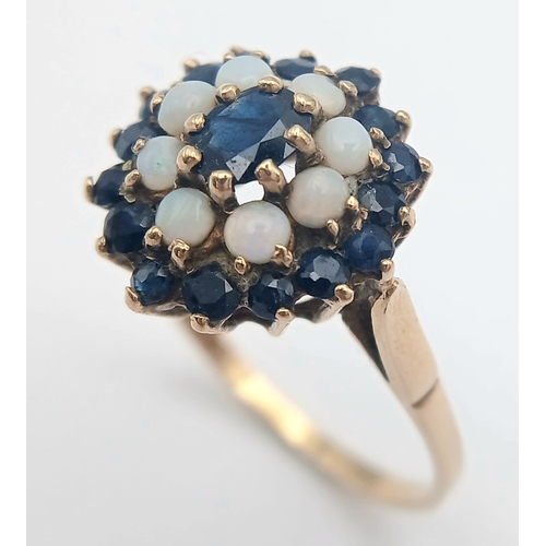 36 - A 9K GOLD RING WITH A CLUSTER OF OPAL AND SAPPHIRES.    2.9fms    size T