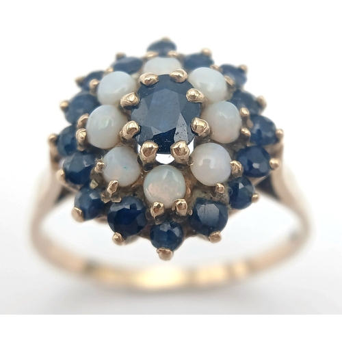 36 - A 9K GOLD RING WITH A CLUSTER OF OPAL AND SAPPHIRES.    2.9fms    size T