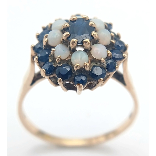36 - A 9K GOLD RING WITH A CLUSTER OF OPAL AND SAPPHIRES.    2.9fms    size T