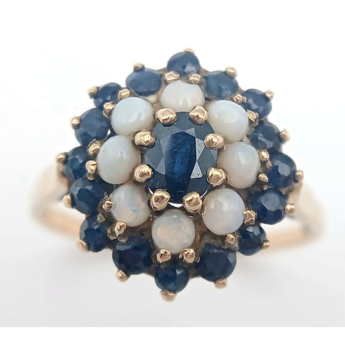 36 - A 9K GOLD RING WITH A CLUSTER OF OPAL AND SAPPHIRES.    2.9fms    size T