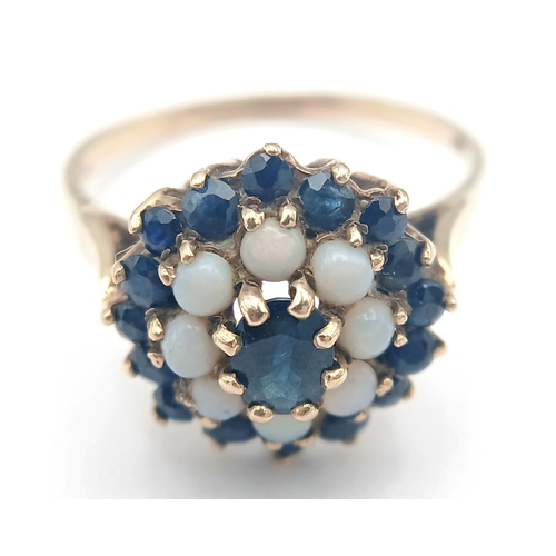 36 - A 9K GOLD RING WITH A CLUSTER OF OPAL AND SAPPHIRES.    2.9fms    size T
