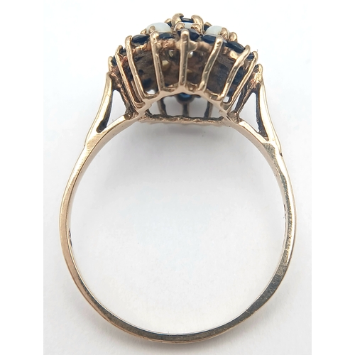 36 - A 9K GOLD RING WITH A CLUSTER OF OPAL AND SAPPHIRES.    2.9fms    size T