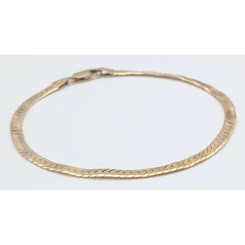 43 - A CLASSIC 9K GOLD HERRINGBONE LINK BRACELET .      4.8gms         19cms