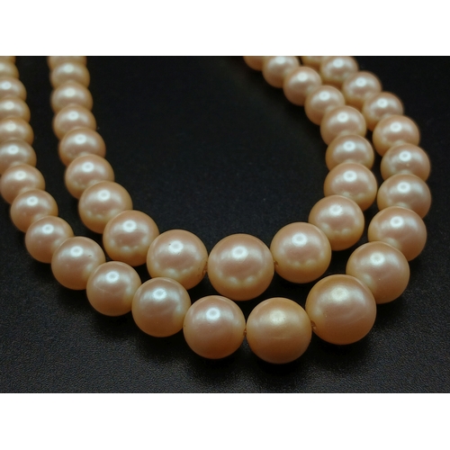 555 - A VINTAGE(1950'S) SET OF SIMULATED PEARLS IN A GRADUATED TWIN CHOKER STYLE AND IN THE ORIGINAL BOX .