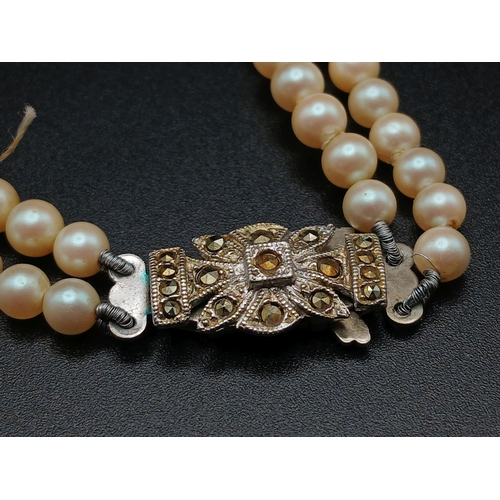 555 - A VINTAGE(1950'S) SET OF SIMULATED PEARLS IN A GRADUATED TWIN CHOKER STYLE AND IN THE ORIGINAL BOX .