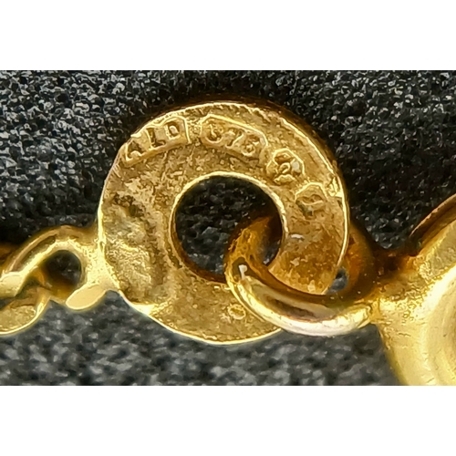 548 - A 9K GOLD NECK CHAIN WITH A CZ PENDANT.    3.7gms    44cms
