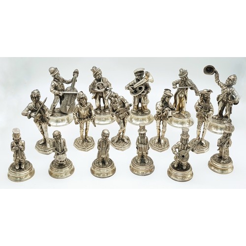 A Collection of Sixteen Spanish Silver Figures of Musicians. Comprising of three different sets. First set of musicians in Medieval dress raised on shaped octagonal bases designed to resemble a cobbled street, each playing a different instrument. The second set of similar size, raised on domed circular feet with different instruments to the first set. The final set of smaller size and comprising of six musicians raised on circular feet, one with an accordion. All sets hallmarked. Largest set stands 14cm tall. Approximately 1400g total weight.