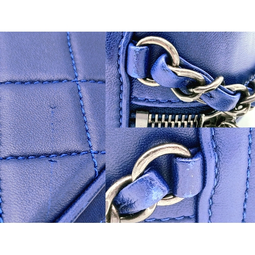 33 - A Chanel Blue Quilted Leather Camera Bag. Blue leather exterior with silver-toned hardware, chain an... 