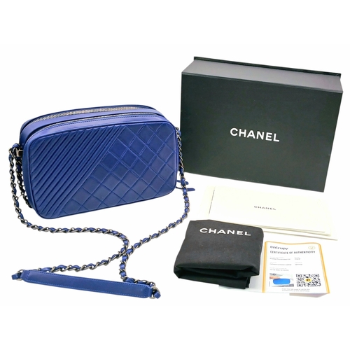 33 - A Chanel Blue Quilted Leather Camera Bag. Blue leather exterior with silver-toned hardware, chain an... 