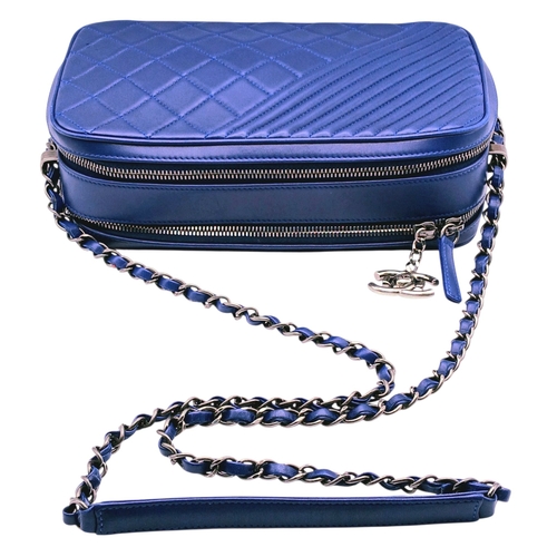 33 - A Chanel Blue Quilted Leather Camera Bag. Blue leather exterior with silver-toned hardware, chain an... 
