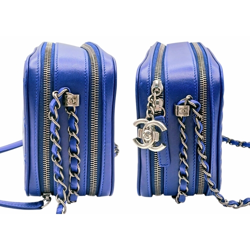33 - A Chanel Blue Quilted Leather Camera Bag. Blue leather exterior with silver-toned hardware, chain an... 
