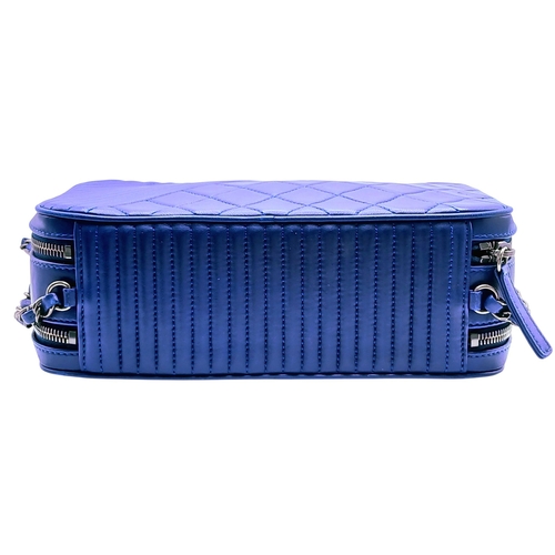 33 - A Chanel Blue Quilted Leather Camera Bag. Blue leather exterior with silver-toned hardware, chain an... 