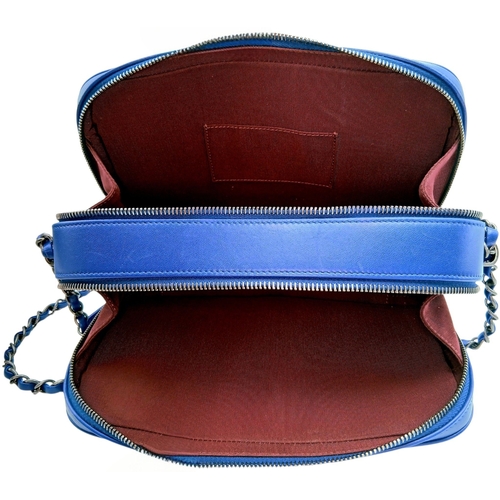 33 - A Chanel Blue Quilted Leather Camera Bag. Blue leather exterior with silver-toned hardware, chain an... 