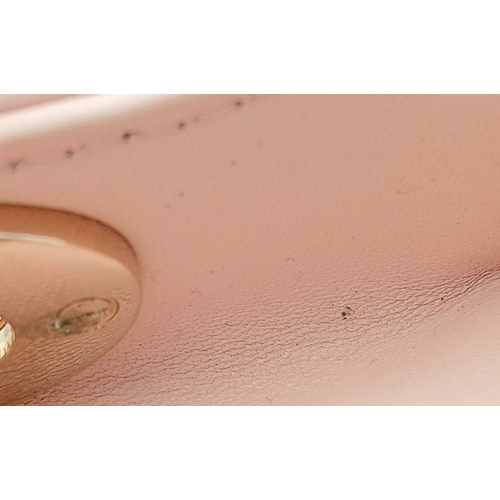 12 - A Christian Dior Blush Pink Cannage Quilted Leather Lady Dior Handbag. Blush pink leather exterior w... 