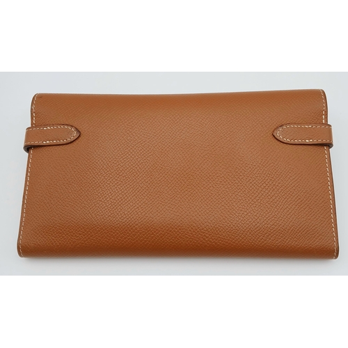 19 - An Hermès Tan Epsom Leather Kelly Long Wallet. Tan Epsom leather exterior with silver-toned hardware... 